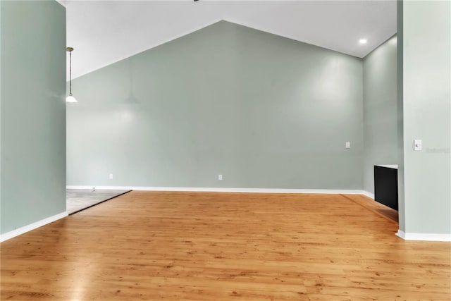 2640 Enterprise Rd E Unit B25, Clearwater, FL 33759 - spare room featuring wood finished floors, vaulted ceiling, and baseboards