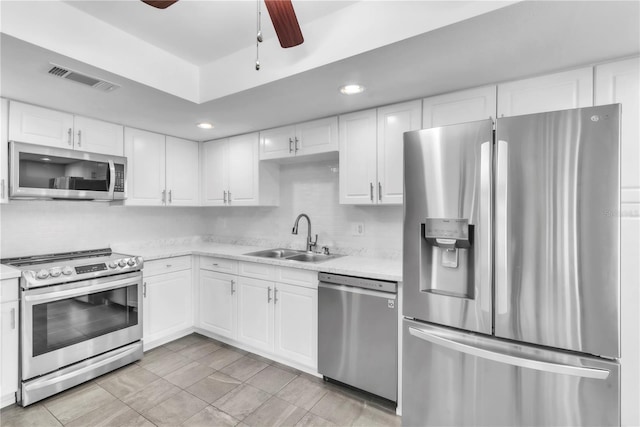 2640 Enterprise Rd E Unit B25, Clearwater, FL 33759 - kitchen with appliances with stainless steel finishes, a sink, light countertops, a ceiling fan, and recessed lighting