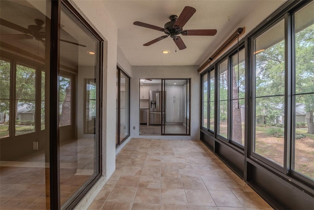 2640 Enterprise Rd E Unit B25, Clearwater, FL 33759 - unfurnished sunroom featuring ceiling fan, healthy amount of natural light, and recessed lighting