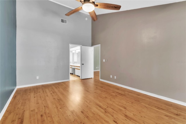 2640 Enterprise Rd E Unit B25, Clearwater, FL 33759 - unfurnished room with high vaulted ceiling, ceiling fan, light wood-style floors, and baseboards