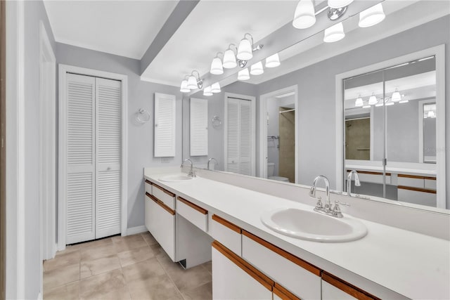 2640 Enterprise Rd E Unit B25, Clearwater, FL 33759 - full bathroom featuring a closet, double vanity, toilet, and tile patterned flooring