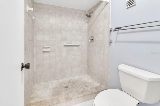 2640 Enterprise Rd E Unit B25, Clearwater, FL 33759 - bathroom featuring tiled shower and toilet