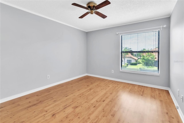 2640 Enterprise Rd E Unit B25, Clearwater, FL 33759 - spare room featuring ceiling fan, wood finished floors, baseboards, and a textured ceiling