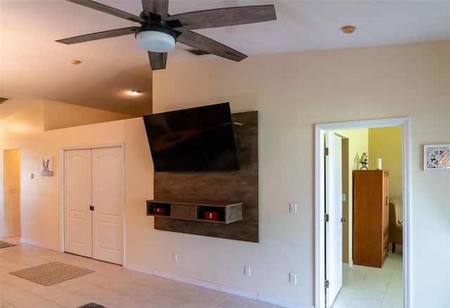 10188 Regent Cir Unit 2802, Naples, FL 34109 - unfurnished living room featuring ceiling fan, baseboards, and light tile patterned floors