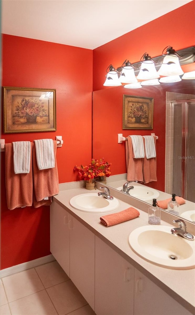 10188 Regent Cir Unit 2802, Naples, FL 34109 - full bathroom with double vanity, tile patterned flooring, and a stall shower
