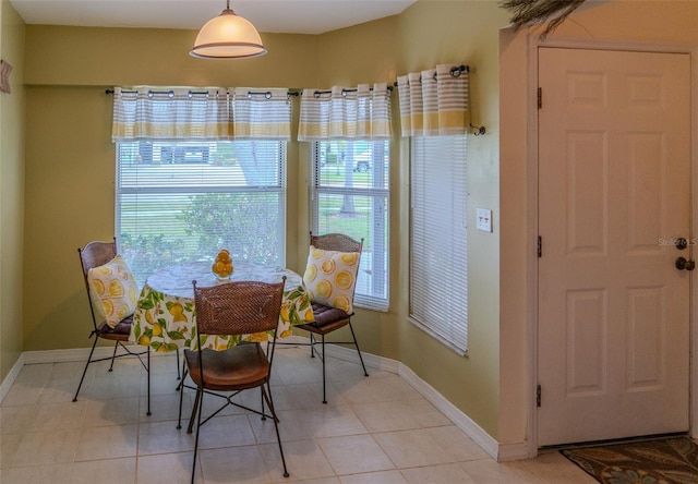 10188 Regent Cir Unit 2802, Naples, FL 34109 - dining room featuring baseboards and light tile patterned floors