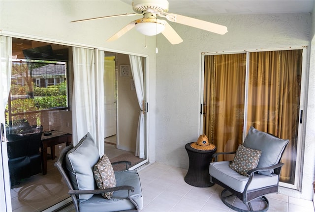 10188 Regent Cir Unit 2802, Naples, FL 34109 - sunroom featuring a textured wall and tile patterned flooring