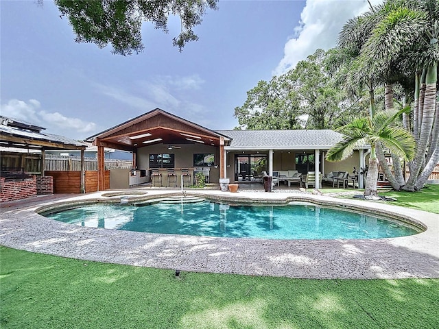 11525 Country Oaks Dr, Tampa, FL 33618 - view of swimming pool featuring a patio, outdoor lounge area, ceiling fan, and a pool with connected hot tub