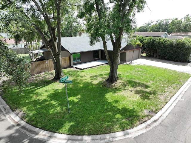 11525 Country Oaks Dr, Tampa, FL 33618 - view of front of house with driveway, an attached garage, and roof with shingles