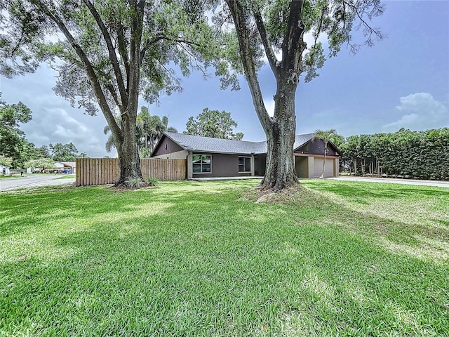 11525 Country Oaks Dr, Tampa, FL 33618 - view of yard featuring a garage and driveway