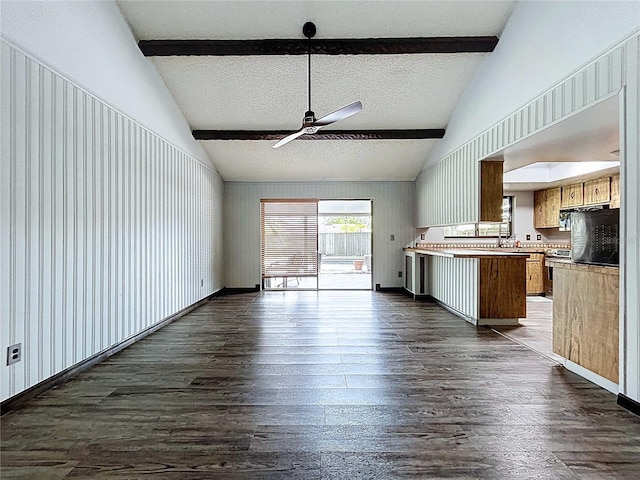 11525 Country Oaks Dr, Tampa, FL 33618 - unfurnished living room featuring a ceiling fan, dark wood-style floors, beam ceiling, high vaulted ceiling, and a textured ceiling