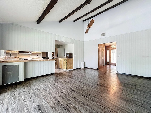 11525 Country Oaks Dr, Tampa, FL 33618 - kitchen with freestanding refrigerator, dark wood-style floors, beam ceiling, high vaulted ceiling, and light countertops