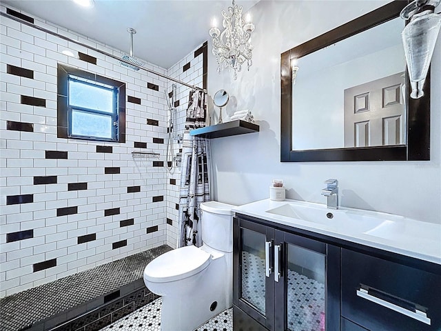 11525 Country Oaks Dr, Tampa, FL 33618 - bathroom with toilet, a stall shower, vanity, and a chandelier