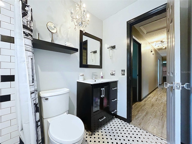 11525 Country Oaks Dr, Tampa, FL 33618 - bathroom featuring toilet, vanity, and wood finished floors