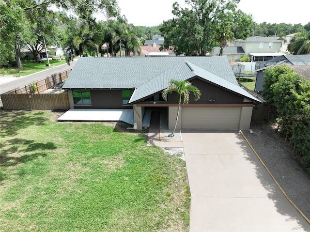 11525 Country Oaks Dr, Tampa, FL 33618 - mid-century inspired home with an attached garage, driveway, roof with shingles, and a residential view