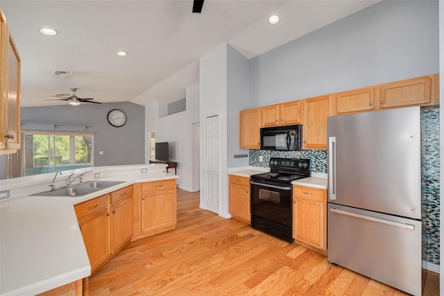 11078 Heathrow Ave, Spring Hill, FL 34609 - kitchen featuring black appliances, a sink, lofted ceiling, ceiling fan, and light wood finished floors