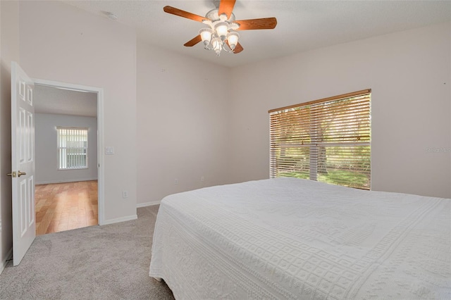 11078 Heathrow Ave, Spring Hill, FL 34609 - carpeted bedroom with a ceiling fan and baseboards