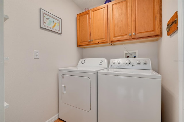 11078 Heathrow Ave, Spring Hill, FL 34609 - laundry area with independent washer and dryer, cabinet space, and baseboards