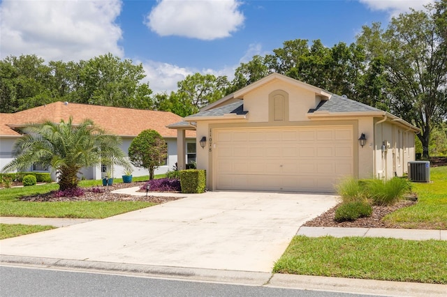 11078 Heathrow Ave, Spring Hill, FL 34609 - single story home featuring central air condition unit, stucco siding, an attached garage, and concrete driveway