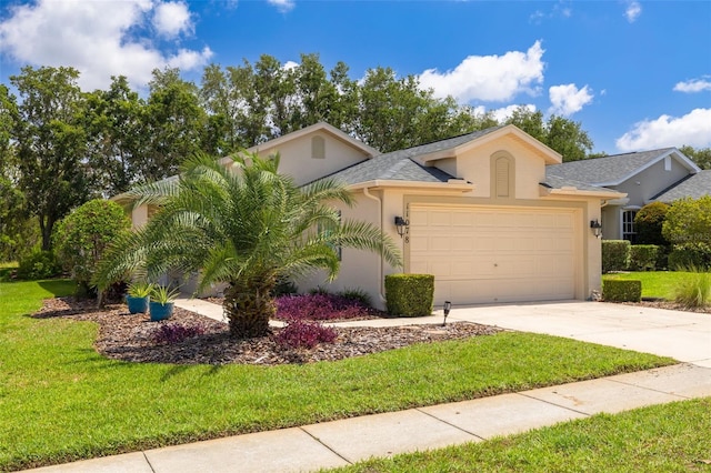 11078 Heathrow Ave, Spring Hill, FL 34609 - view of front of property with stucco siding, an attached garage, concrete driveway, and a front yard