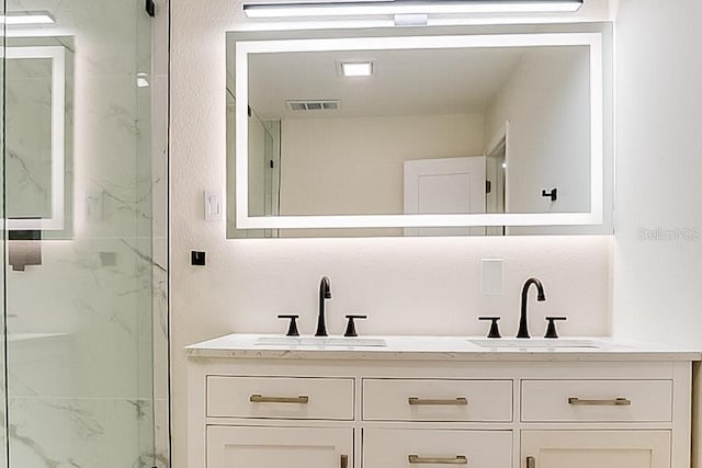 7620 N 74th St, Pinellas Park, FL 33781 - full bath featuring double vanity and a marble finish shower