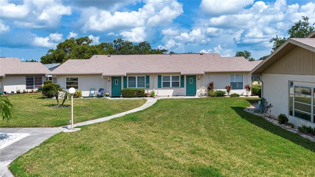 1906 Canterbury Ln Unit 20, Sun City Center, FL 33573 - ranch-style home featuring a front yard