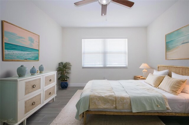 1906 Canterbury Ln Unit 20, Sun City Center, FL 33573 - bedroom with dark wood-style flooring, baseboards, and a ceiling fan