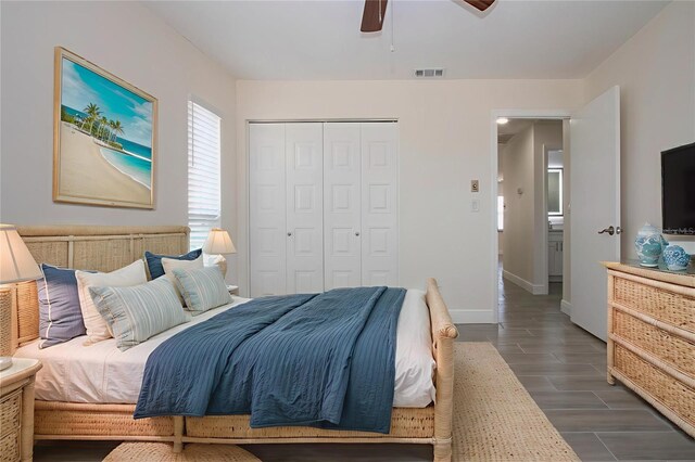 1906 Canterbury Ln Unit 20, Sun City Center, FL 33573 - bedroom with wood tiled floors, a closet, baseboards, and a ceiling fan
