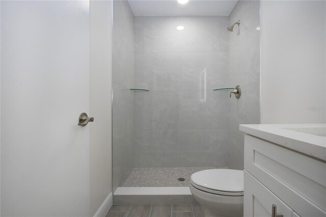 1906 Canterbury Ln Unit 20, Sun City Center, FL 33573 - full bath with vanity, tiled shower, toilet, and tile patterned floors