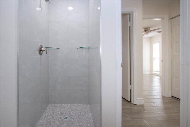 1906 Canterbury Ln Unit 20, Sun City Center, FL 33573 - full bathroom with a tile shower, a ceiling fan, tile patterned floors, and baseboards
