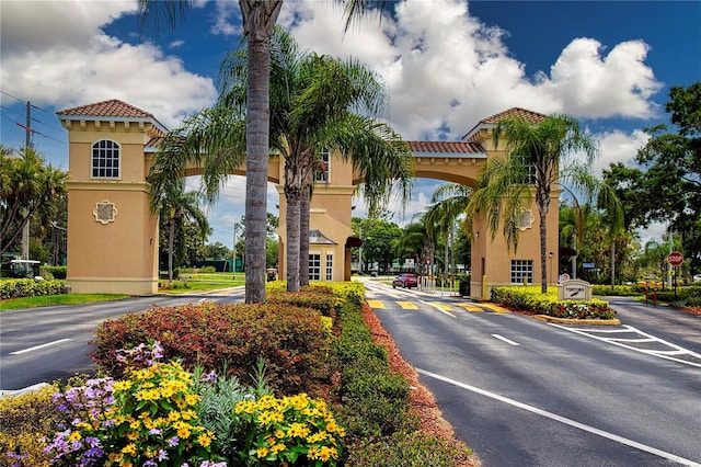 1906 Canterbury Ln Unit 20, Sun City Center, FL 33573 - view of asphalt road with traffic signs and street lighting