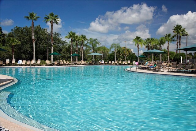1906 Canterbury Ln Unit 20, Sun City Center, FL 33573 - community pool with a patio area