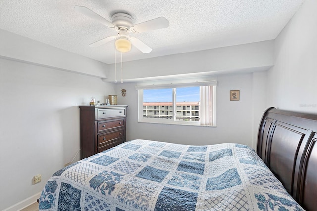 9461 Harbor Greens Way Unit 502, Seminole, FL 33776 - bedroom with a textured ceiling, ceiling fan, and baseboards