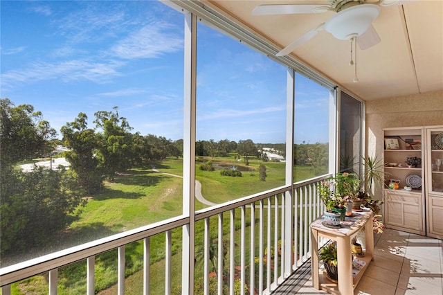 9461 Harbor Greens Way Unit 502, Seminole, FL 33776 - sunroom featuring a ceiling fan and tile patterned floors