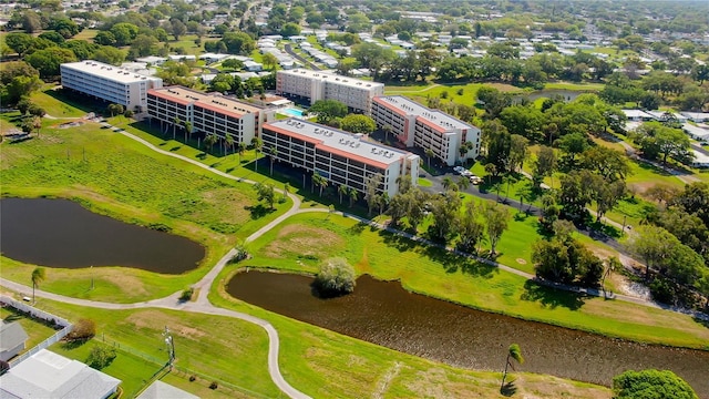 9461 Harbor Greens Way Unit 502, Seminole, FL 33776 - drone / aerial view of a large body of water and apartment complex