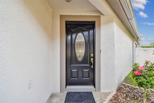 19409 Weymouth Dr, Land O Lakes, FL 34638 - entrance to property with stucco siding