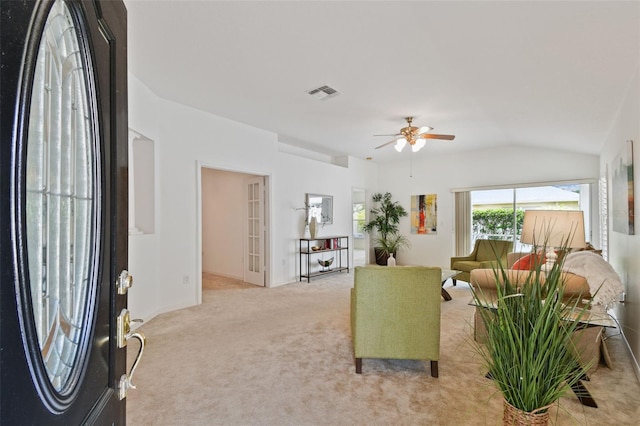 19409 Weymouth Dr, Land O Lakes, FL 34638 - living area with ceiling fan, lofted ceiling, light carpet, and baseboards