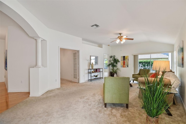 19409 Weymouth Dr, Land O Lakes, FL 34638 - living area featuring ceiling fan, light carpet, arched walkways, lofted ceiling, and decorative columns