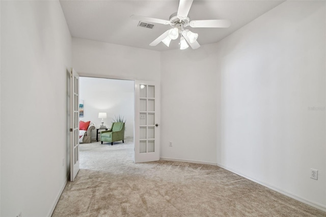 19409 Weymouth Dr, Land O Lakes, FL 34638 - empty room featuring french doors, carpet, a ceiling fan, and baseboards