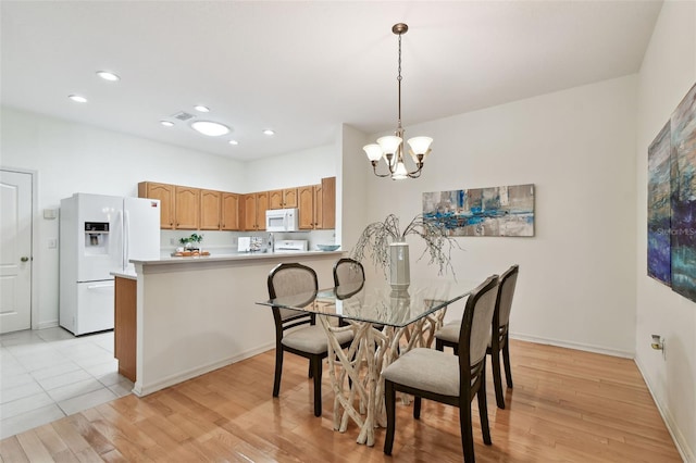 19409 Weymouth Dr, Land O Lakes, FL 34638 - dining area featuring a chandelier, light wood finished floors, baseboards, and recessed lighting