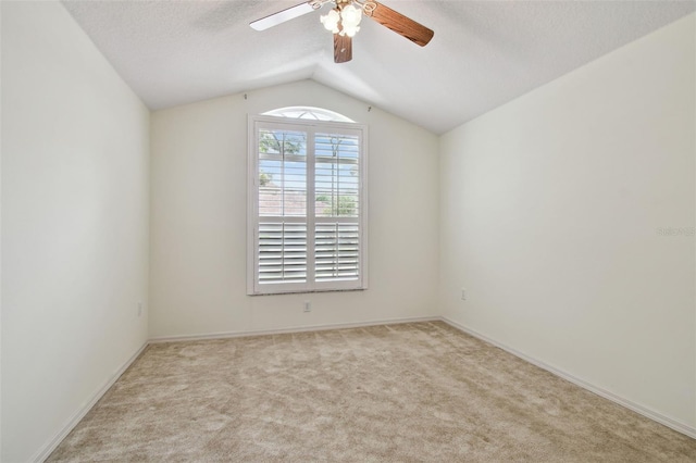 19409 Weymouth Dr, Land O Lakes, FL 34638 - empty room featuring lofted ceiling, carpet, ceiling fan, a textured ceiling, and baseboards