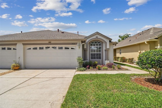 19409 Weymouth Dr, Land O Lakes, FL 34638 - single story home with an attached garage, concrete driveway, and stucco siding