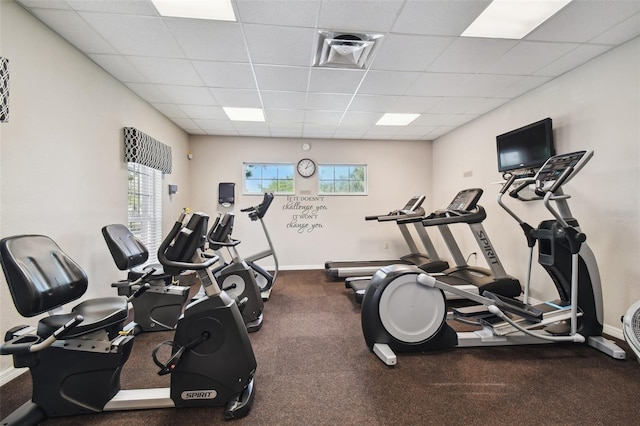19409 Weymouth Dr, Land O Lakes, FL 34638 - workout area featuring a paneled ceiling and baseboards