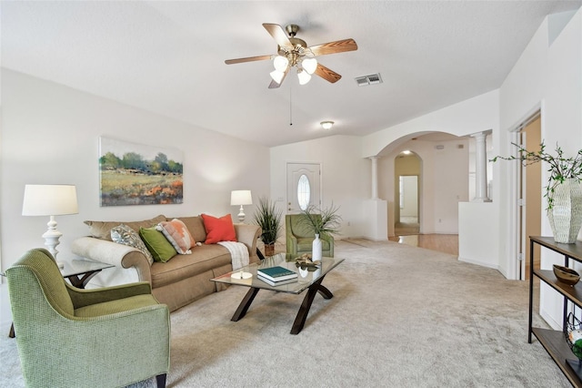 19409 Weymouth Dr, Land O Lakes, FL 34638 - living area featuring arched walkways, ornate columns, a ceiling fan, and light colored carpet
