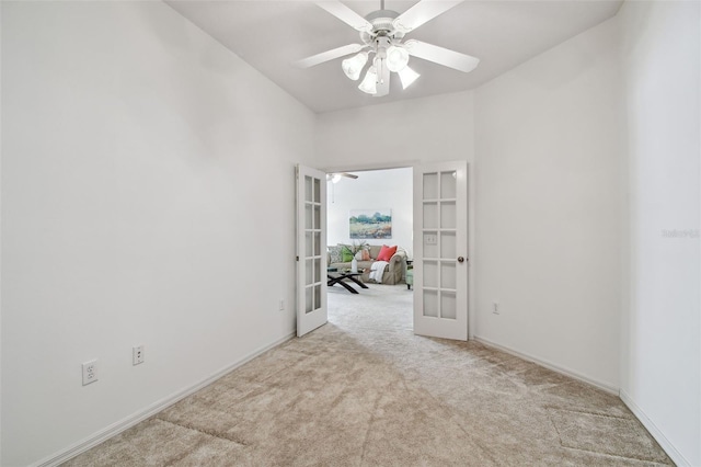 19409 Weymouth Dr, Land O Lakes, FL 34638 - empty room with french doors, carpet flooring, baseboards, and a ceiling fan
