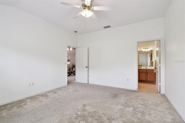 19409 Weymouth Dr, Land O Lakes, FL 34638 - unfurnished bedroom with light carpet, ensuite bath, and baseboards