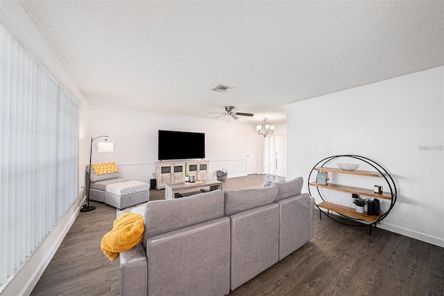 13013 Sawmill Way, Hudson, FL 34667 - living area featuring wood finished floors, a textured ceiling, a chandelier, baseboards, and ceiling fan