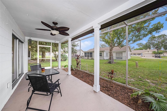 13013 Sawmill Way, Hudson, FL 34667 - sunroom / solarium with a ceiling fan, a residential view, and outdoor dining area