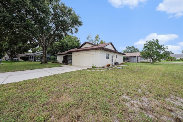 13013 Sawmill Way, Hudson, FL 34667 - view of front facade featuring an attached garage, a front lawn, and concrete driveway