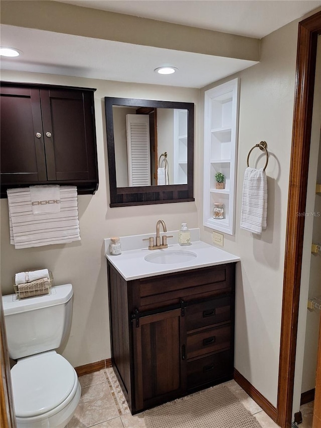 3536 Countrybrook Ln Unit 13, Palm Harbor, FL 34684 - bathroom featuring vanity, built in shelves, and recessed lighting